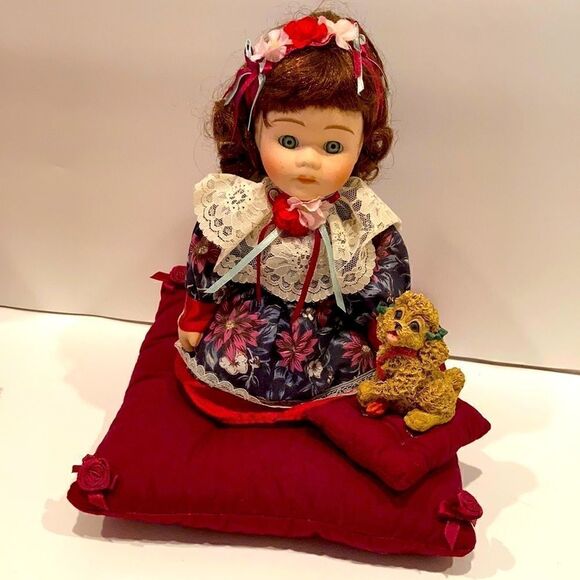 Porcelain doll with pet dog on matching cushions - Picture 1 of 5